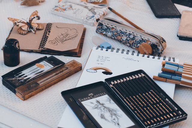 Creative workspace with sketchbooks and art supplies